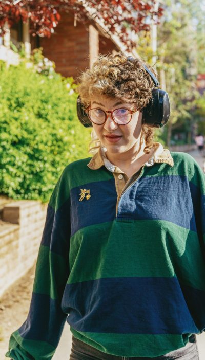 neurodiversity-affirming-counselling-vancouver-and-online A neurodivergent person with autism wearing headphones to prevent them from being overstimulated