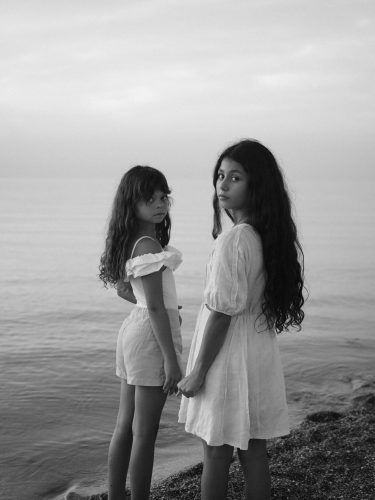 adult-well-sibling-therapy-kitsilano Two siblings standing one focused on the other, illustrating the complex dynamic of being the well sibling alongside a sibling with an illness.