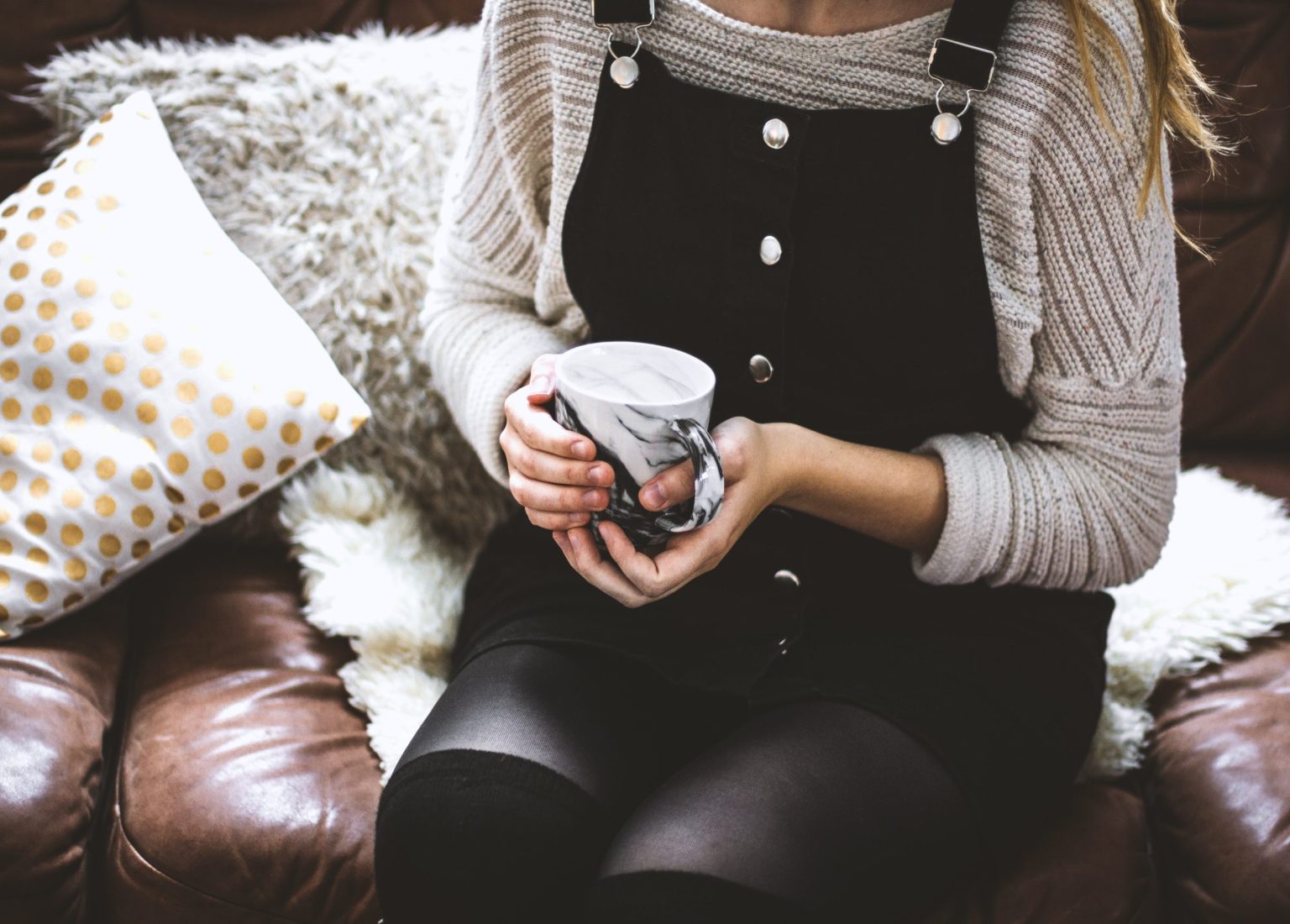 A woman holding tea at her counselling appointment in Kitsilano at Haven Wellness Collective