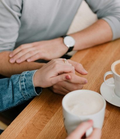 A couple engaging in a healthy repair attempt during a session with a Vancouver therapist, focusing on communication and apology languages.