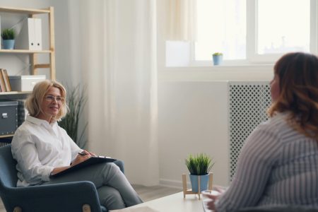 registered-clinical-counsellor-trauma-therapy-vancouver A trauma-informed therapist and client in a safe, supportive counselling session at Haven Wellness Collective in Kitsilano.