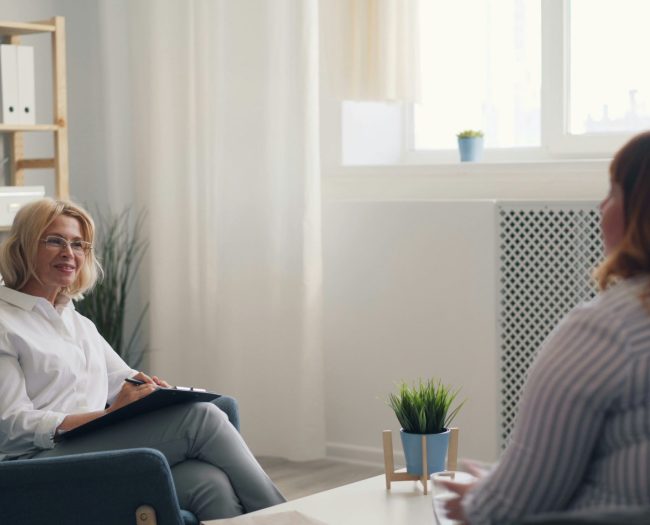 registered-clinical-counsellor-trauma-therapy-vancouver A trauma-informed therapist and client in a safe, supportive counselling session at Haven Wellness Collective in Kitsilano.