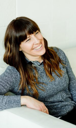 An EMDR therapist in Kitsilano is sitting on the couch talking to her client