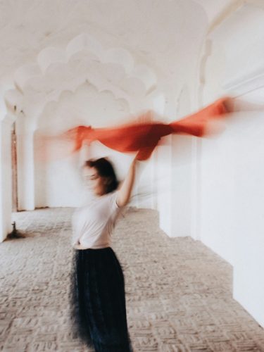 window-of-tolerance-vancouver-counselling A woman practicing somatic movement to regulate her nervous system at a Vancouver therapy clinic.